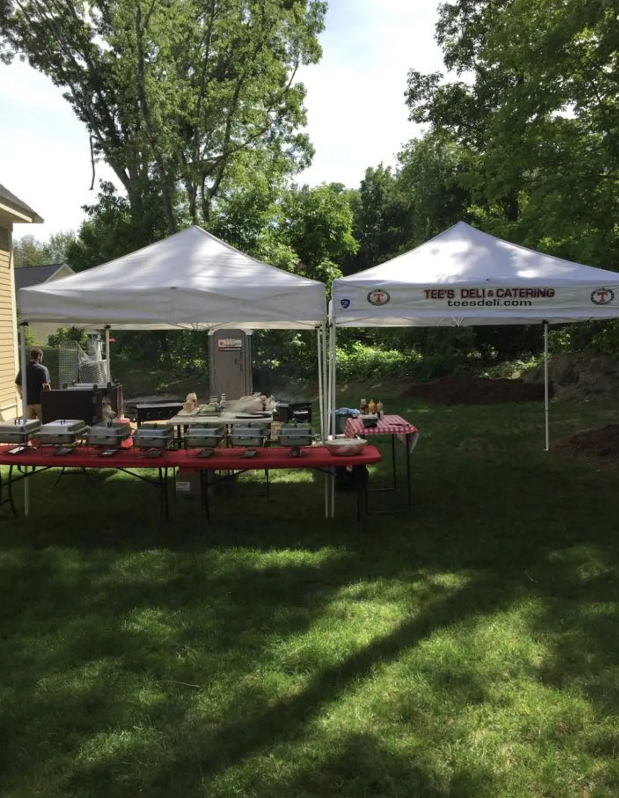 Two tents up for a backyard celebration